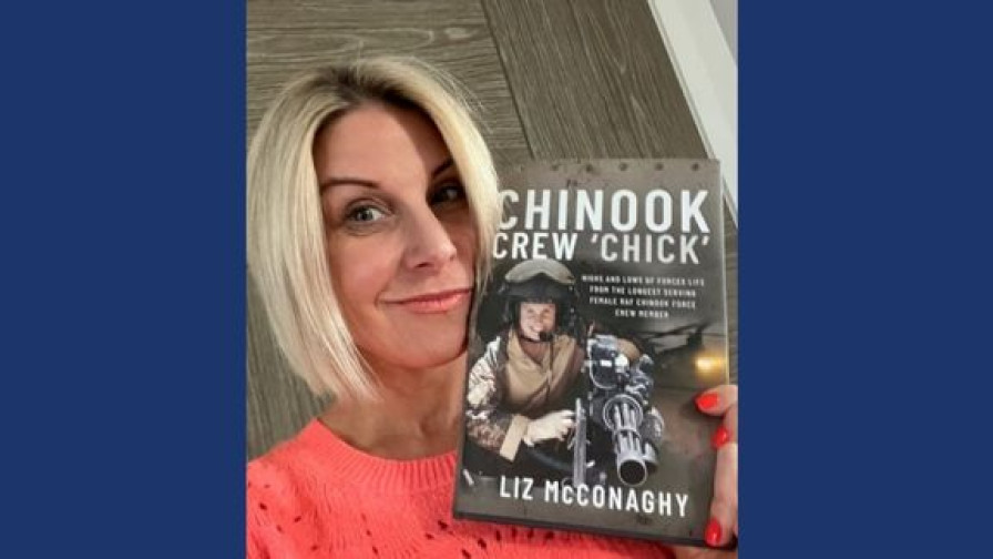 RAF Veteran Liz holding her book Chinook Crew Chick